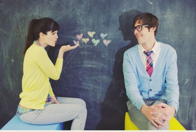 a chalkboard with pastel hearts is always a good idea for a Valentine engagement and it doesn't look boring