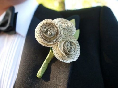 a boutonniere made of newspaper flowers is a stylish and cool idea for any wedding, including a modern and a vintage one