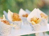 food cones made of white paper and newspaper outside to give them a unique look