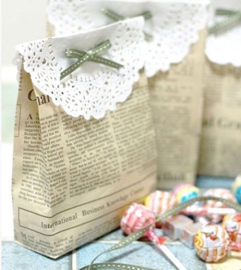 newspaper bags with doilies and little bows are amazing for any wedding, they can be a nice solution to give wedding favors