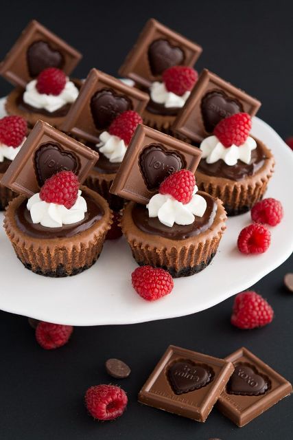 chocolate fudge cupcakes with frosting, chocolate pieces and raspberries are lovely sweet appetizers or desserts for a Valentine's Day wedding