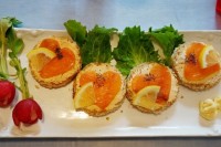 tartlets with cream cheese and heart-shaped salmon on top are delicious Valentine wedding appetizers that look sweet