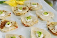 heart-shaped pancakes topped with fresh butter and herbs are adorable as Valentine wedding appetizers