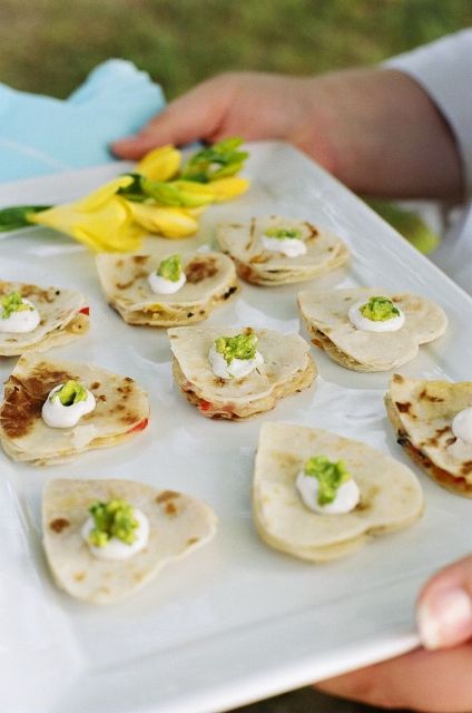 heart-shaped pancakes topped with fresh butter and herbs are adorable as Valentine wedding appetizers