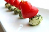 Valentine Caprese skewers with herbed mozzarella cheese and heart-shaped tomatoes are fun and lovely appetizers for a Valentine wedding