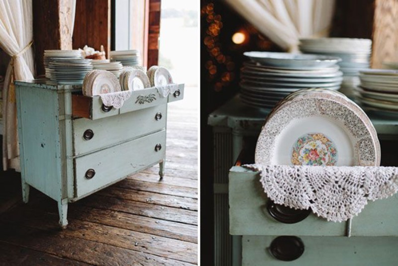 a neutral vintage dresser as a stand for porcelain that is wedding favors