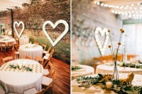 a stylish industrial wedding venue with brick walls, marquee hearts and lovely chevron runners and billy balls