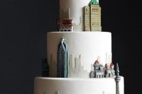 a white wedding cake with sugar detailign that shows off your favorite city – New York