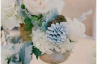 a cluster wedding centerpiece composed of white, serenity blue blooms and pale foliage is a lovely idea for a delicate wedding