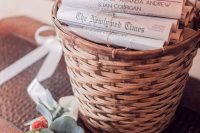 a basket with newspaper dedicated to the couple and the wedding is a lovely and fun wedding favor idea to rock