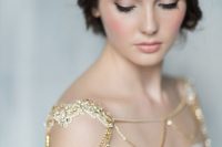 a beautiful gold embellished shoulder chain piece is a romantic and shiny idea for accenting a look