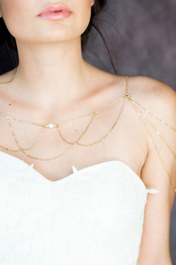 a gold and bead shoulder chain is a very chic and delicate piece that you may wear with many types of dresses