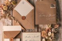 a kraft paper wedding invitation suite with black and white calligraphy, pretty seals is a cool idea for an earthy-tone wedding