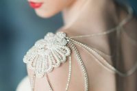 a refined crystal shoulder necklace with a gold lace touch is a chic piece to wear with your wedding dress
