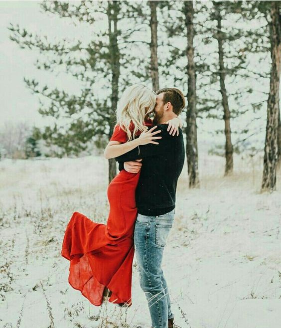 a snowy Valentine engagement with a red dress is a lovely idea to enjoy
