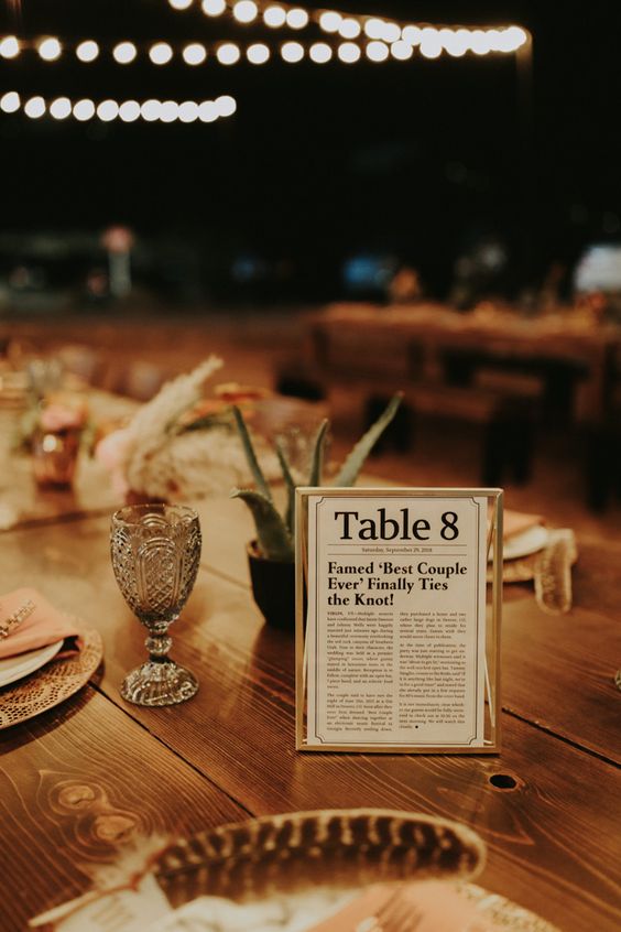 a table number styled as a newspaper is a cool and pretty idea for your wedding, it's a creative solution to rock