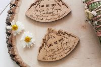burnt wooden save the dates shaped as mountains are great for a ski resort or mountain wedding
