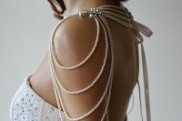elegant pearl shoulder jewelry with rhinestones and pearl threads hanging down is very chic and elegant
