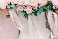 rose quartz strapless bridesmaid dresses and matching rose bouquets with greenery look super tender