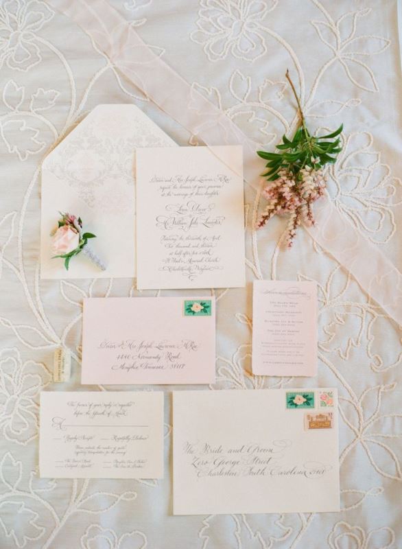 a wedding invitation suite in neutrals and rose quartz, with printed patterns and touches of green