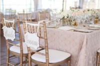 embroidered rose quartz tablecloths and neutral and rose quartz blooms for centerpieces will create a very romantic look at the reception