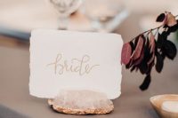 rose quartz and gold leaf card holders for a chic and refined look at the reception