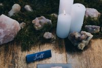 rose quatz crystals, pillar candles and moss to create an unforgettable and enchanting wedding tablescape