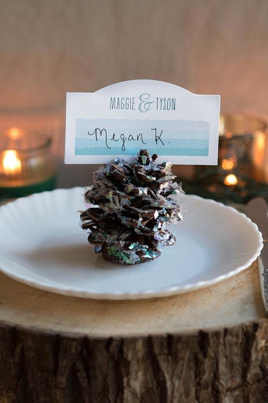 Picture Of rustic glam diy pinecone place settings for your winter wedding  2