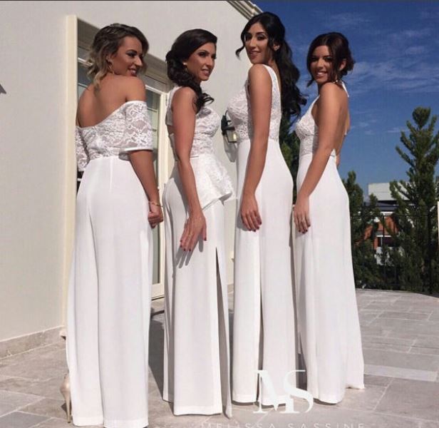 girlish mismatching white bridesmaid jumpsuits with lace tops and wideleg plain pants for a summer wedding