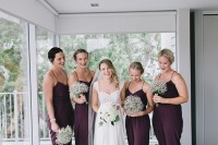 fitting purple spaghetti strap jumpsuits with draped bodices are great for a fall wedding