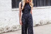 a sleveless fitting black lace bridesmaid jumpsuit with side cutouts and wideleg pants