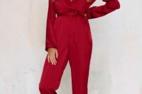 a hot red wrap jumpsuit with long sleeves, pockets and a deep V-neckline