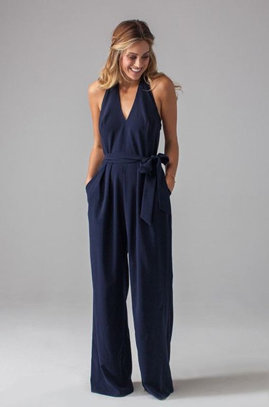 a navy thick strap sleeveless jumpsuit with wideleg pants and pockets and a sash for an accent