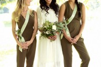 sleeveless olive green fitting jumpsuits with V-necklines look nice at a fall wedding