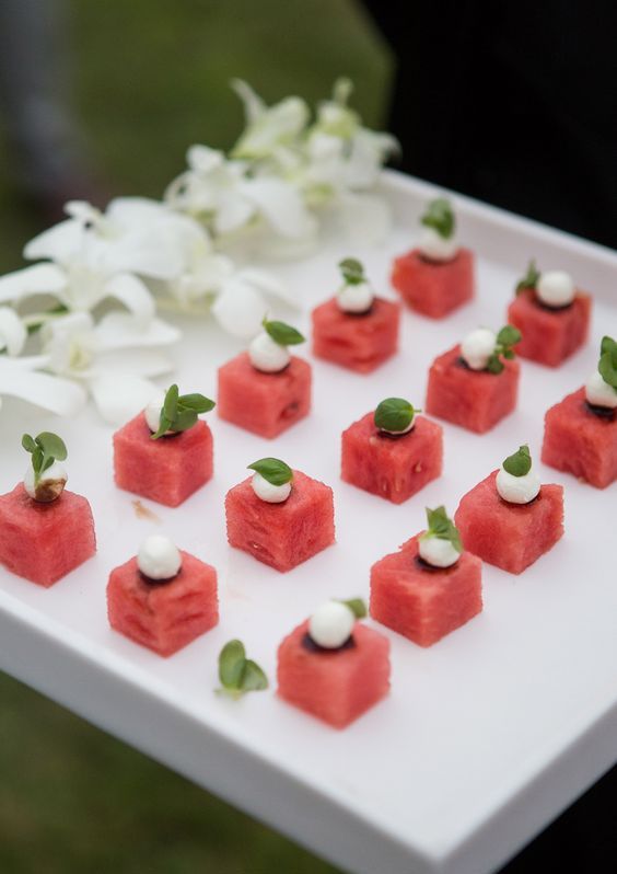 watermelon cubes with mozzarella cheese and fresh herbs are delicious and cool Valentine wedding appetizers