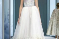 a strapless midi wedding dress with a bustier top and a full skirt with colorful floral embroidery for a wow look