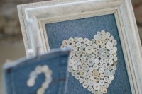 a denim artwork of buttons in a neutral frame and a pocket with a table number of buttons for a cowboy wedding