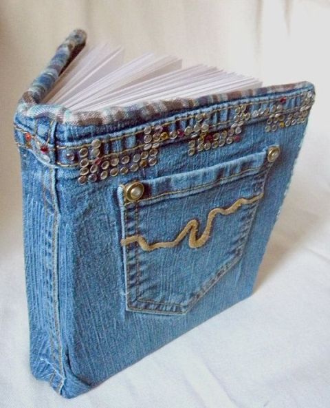 a guest book wrapped with blue denim and a pocket is a cool idea for a modern or casual edding