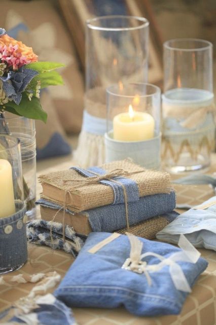 a denim ring pillow and some guest books wrapped with burlap and denim for a casual wedding