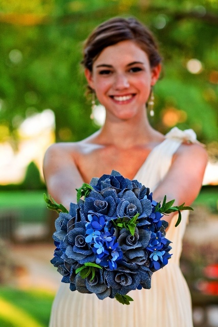 a blue wedding bouquet with bright blue blooms and those made of denim for a non-traditional look