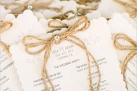 wedding programs decorated with twine and rhinestones are pretty and cool for a rustic and glam wedding