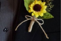 a rustic wedding boutonniere of a sunflower and greenery wrapped in twine is a very cool and pretty idea
