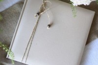 a wedding favor wrapepd with twine and with beads is a lovely idea for a rustic wedding