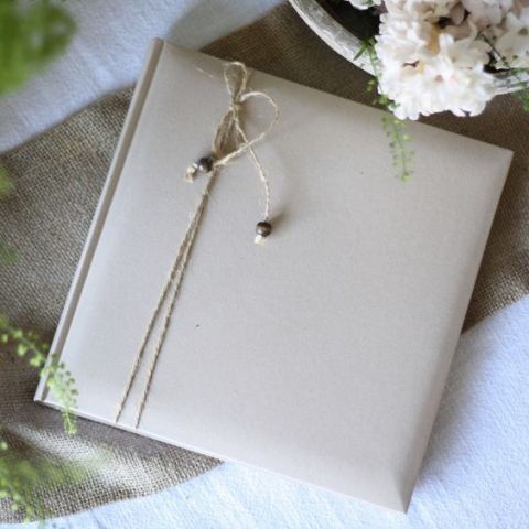 a wedding favor wrapepd with twine and with beads is a lovely idea for a rustic wedding