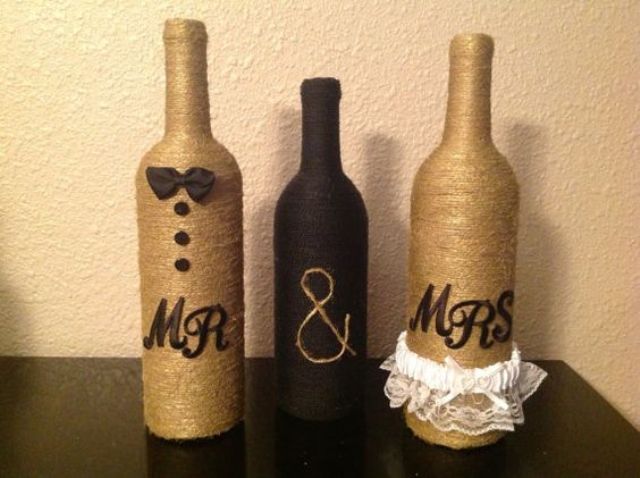 bottles wrapped with usual and black twine with monograms is a lovely and fun DIY wedding decor idea