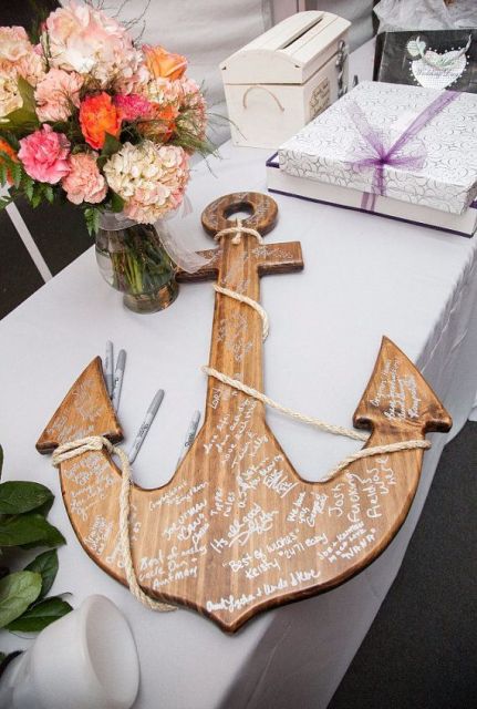a stained wooden anchor will become a creative and cool wedding guest book, use it for a seaside or nautical wedding