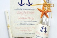 a wedding invitation with anchors, a wine bottle with a personalized tag with anchors and a starfish is a lovely idea for a nautical wedding