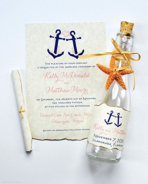 a wedding invitation with anchors, a wine bottle with a personalized tag with anchors and a starfish is a lovely idea for a nautical wedding