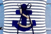 a striped pillow with a navy anchor and rope is a lovely ring pillow for a wedding or can be used just as decor
