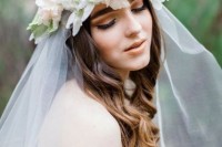 a spring flower crown with peachy pink and white blooms, a bit of greenery and white veil is a dreamy and airy idea for spring